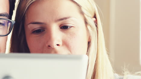 young-couple-shopping-online-using-digital-tablet-computer-ipad